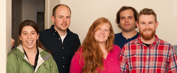 Group of five people smiling
