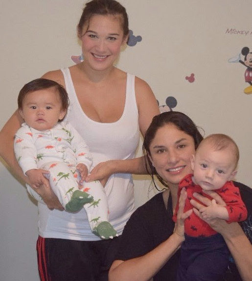 A family including two women and two babies.